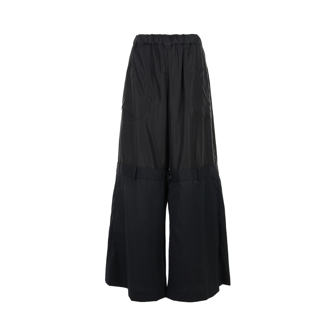 Noir Kei Ninomiya black wide-leg pants in cupra twill and wool gabardine with elasticated waist and layered tailored lower section