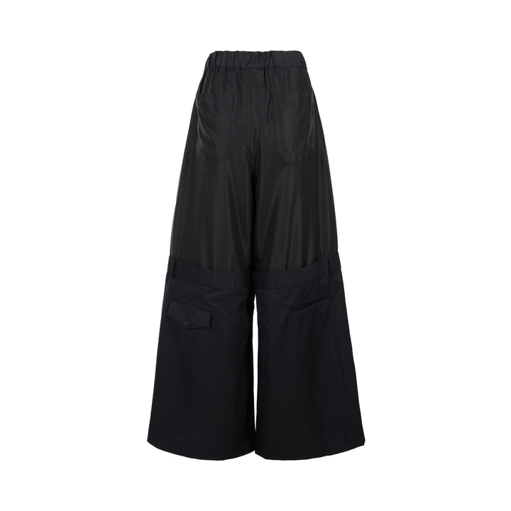 Noir Kei Ninomiya black wide-leg pants in cupra twill and wool gabardine with elasticated waist and layered tailored lower section - view 2
