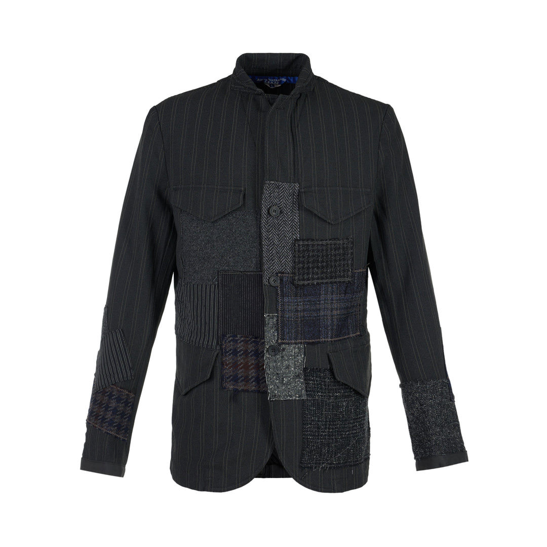 Junya Watanabe MAN charcoal pinstripe jacket with mixed wool patchwork panels, stand collar and flap pockets, front view