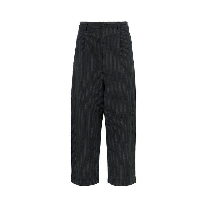 Junya Watanabe charcoal pinstripe wide-leg pants with front pleat and button closure, shown from the front