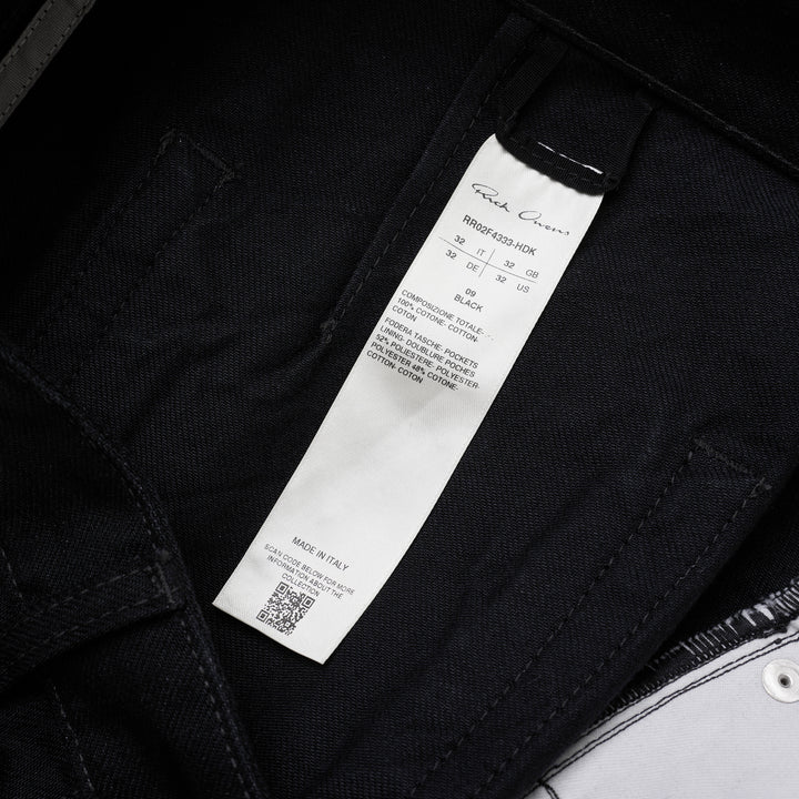 Rick Owens Geth Jeans in black denim with a wide-leg silhouette, shown from the front with button fly and five-pocket detailing - view 3