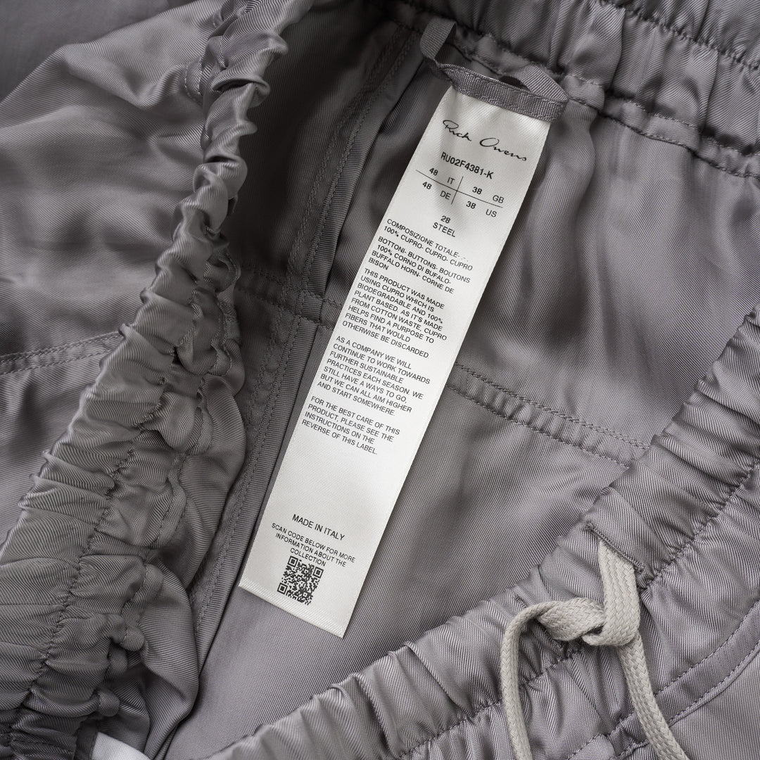 Rick Owens grey drawstring cropped pants with a dropped crotch, elasticated waistband and fluid, semi-sheer fabric, shown from the front - view 3