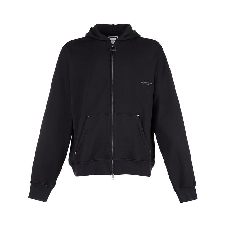 Black Wooyoungmi zip-up hoodie with padlock-style zip pull, stud-detailed kangaroo pockets and small gold logo on the chest