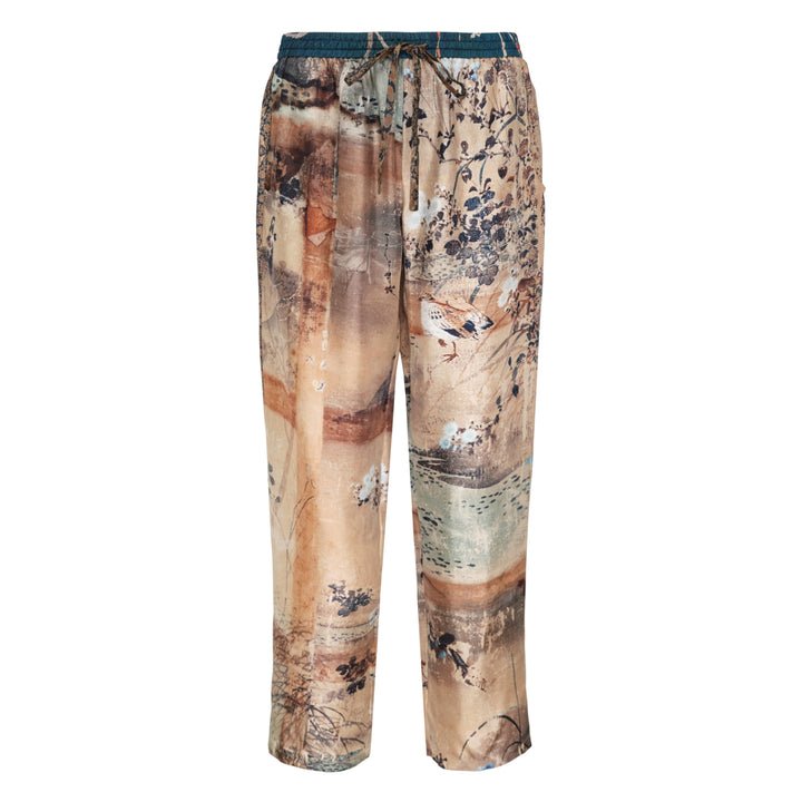 Pierre-Louis Mascia Aloe printed trousers with an artistic East Asian-inspired landscape print featuring birds, florals, and botanical motifs on warm sand and terracotta tones, with a teal elasticated drawstring waistband