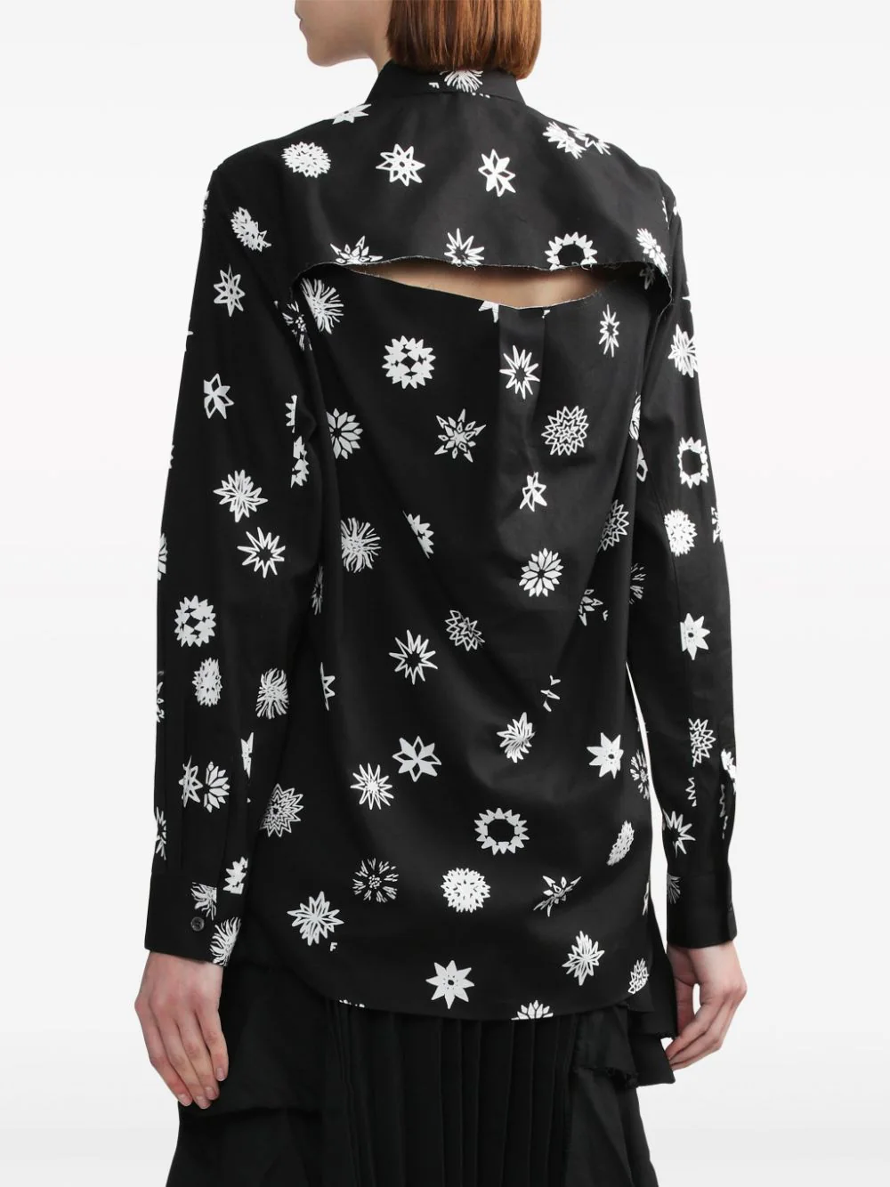 Comme des Garçons BLACK Filip Pagowski Print Blouse in black with allover white snowflake and floral graphic motifs, long sleeves and point collar, flat lay view