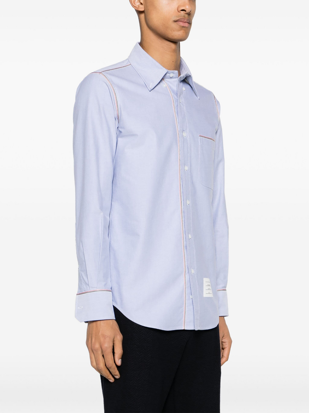 Thom Browne Oxford Grosgrain Framing Shirt in light blue with red, white, and blue tricolor grosgrain trim along the placket and cuffs