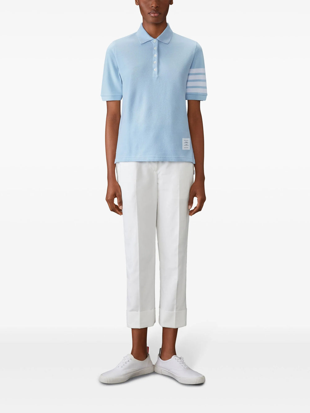 Thom Browne light blue short sleeve piqué polo shirt with white 4-bar stripe on sleeve and tri-colour hem trim, made in Italy