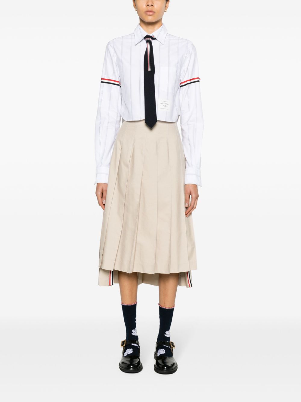 Thom Browne white pinstripe oxford cropped shirt with red, white and black grosgrain armband stripe on the sleeve and button-down collar