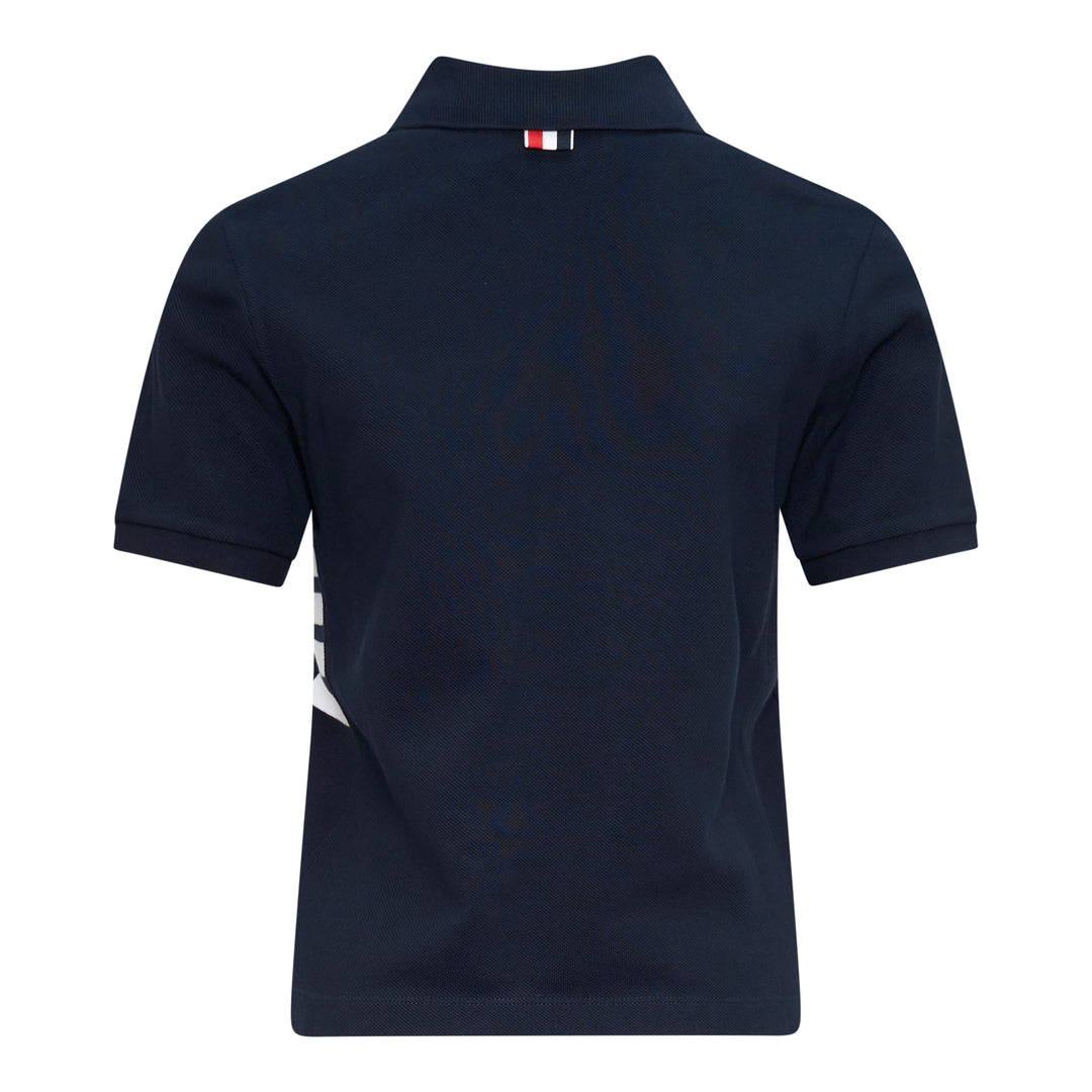 Thom Browne Short Sleeve Rib Cuff Polo in light blue piqué cotton with spread collar, four-button placket and signature stripe grosgrain tab