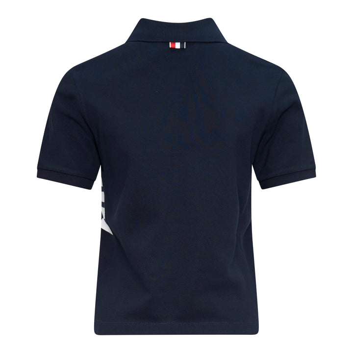Thom Browne Short Sleeve Rib Cuff Polo in light blue piqué cotton with spread collar, four-button placket and signature stripe grosgrain tab