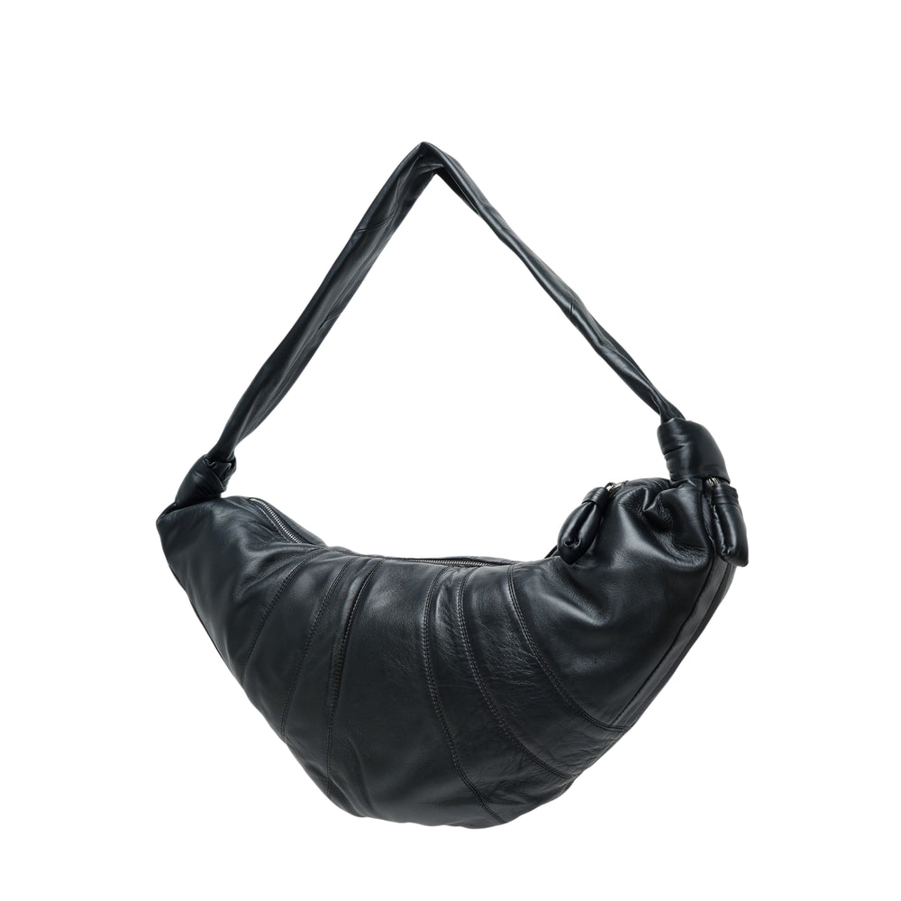 Lemaire Large Croissant Soft Nappa Bag in black, crescent silhouette with radiating topstitched panels and knotted shoulder strap