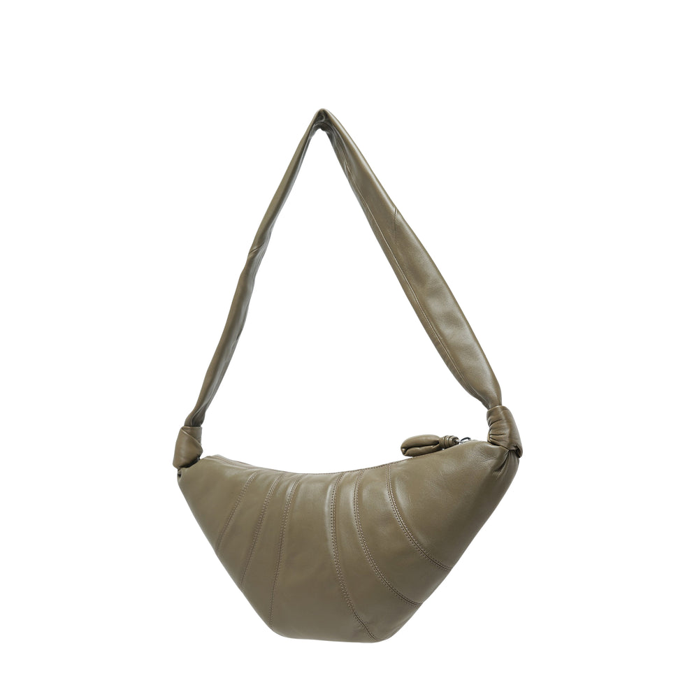 Lemaire Medium Croissant Bag in olive khaki soft nappa leather, crescent silhouette with panel stitching, twisted padded shoulder strap and zip closure