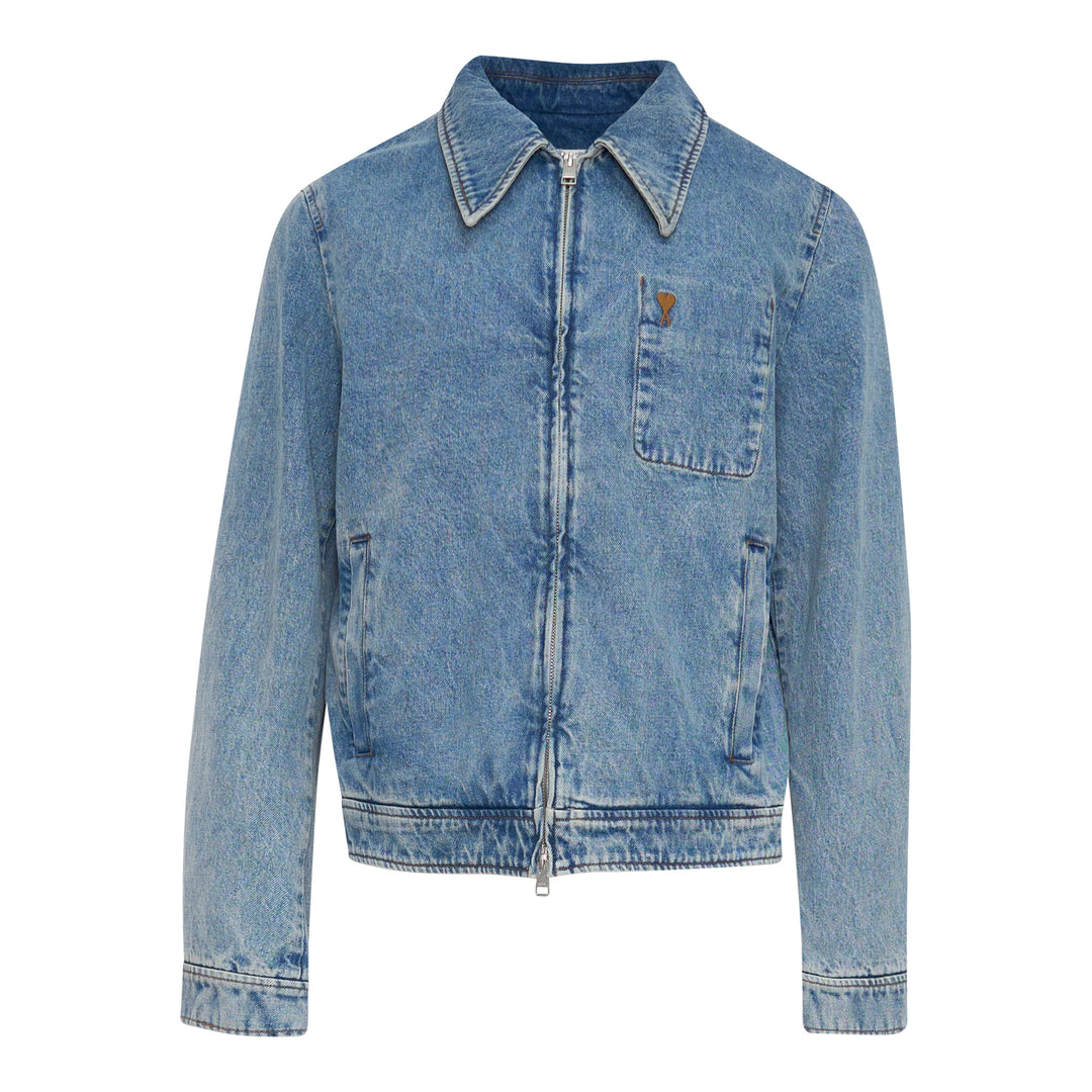 AMI Paris Ami de Cœur Zipped Blouson in washed blue denim with full-length zip closure, pointed collar, chest patch pocket with heart logo, and cropped silhouette