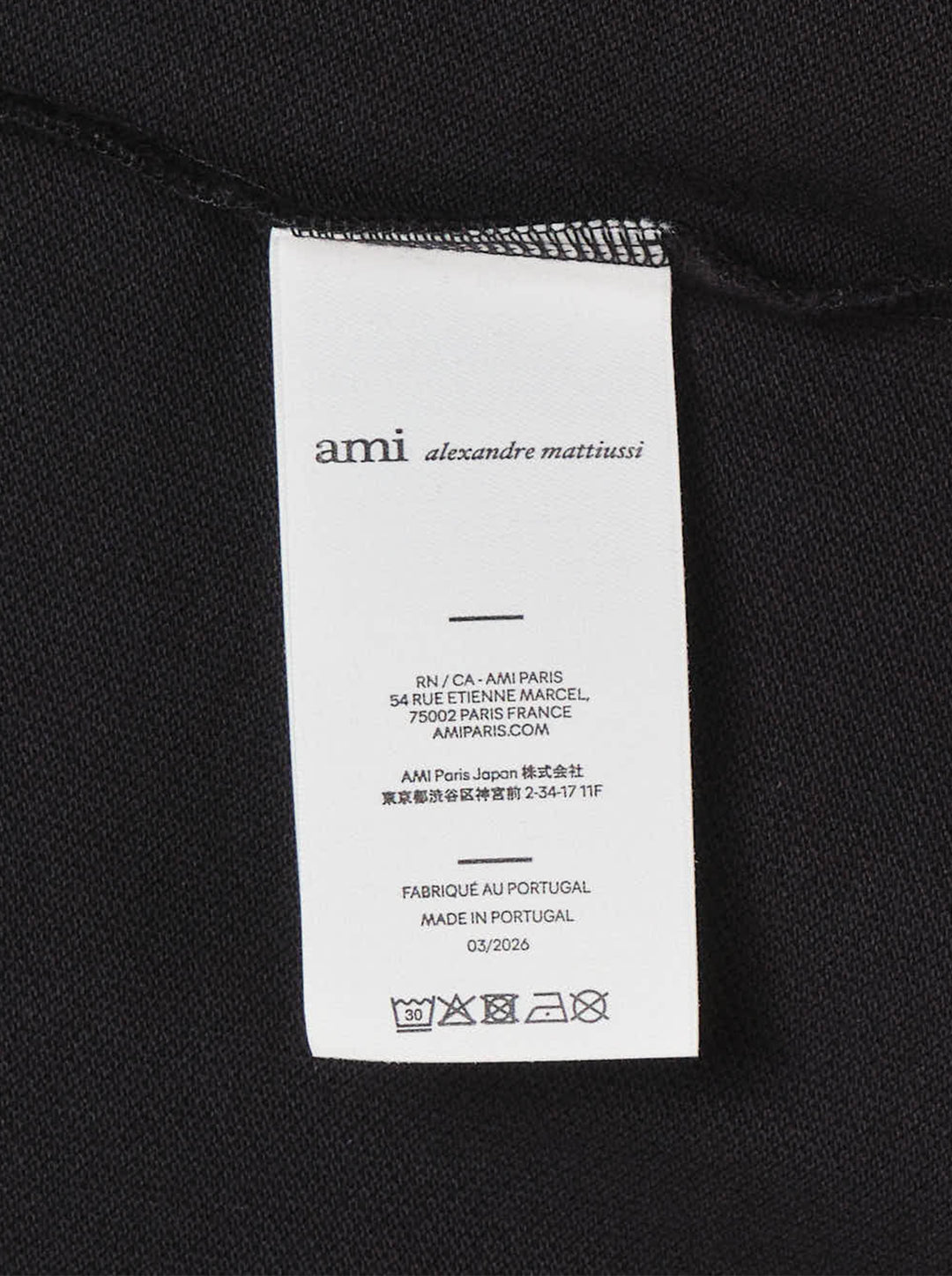 Ami Alexandre Mattiussi black piqué polo shirt with white Ami de Cœur logo embroidery on the chest and a two-button placket, front view - view 4