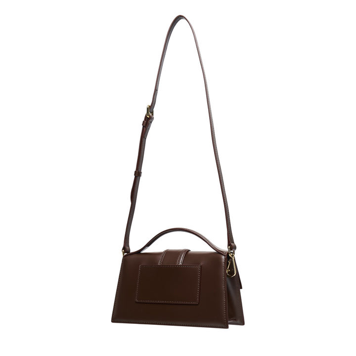 Jacquemus Le Grand Bambino smooth dark brown leather shoulder bag with adjustable crossbody strap, curved top handle, central flap tab closure, and gold-tone hardware and branding - view 2