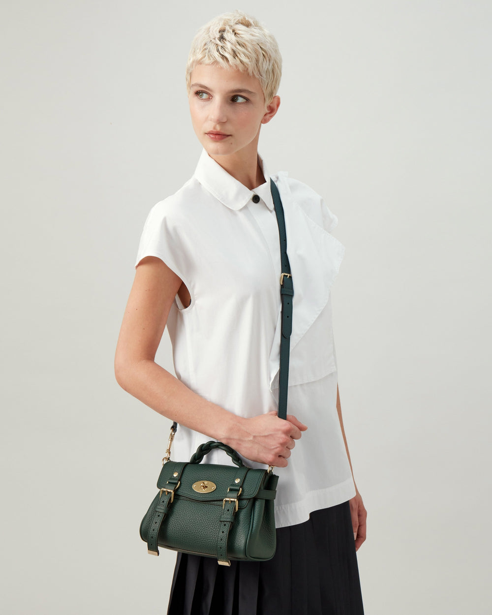 Mulberry Mini Alexa Heavy Grain leather handbag in forest green with braided top handle, gold Postman's Lock closure, decorative buckle straps, and detachable crossbody strap
