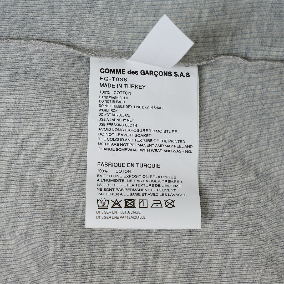 COMME des GARCONS SHIRT Oversized Printed Humanity T-Shirt – Available at Club 21, Official Retailer in Singapore, Malaysia & Thailand with Global Shipping Online