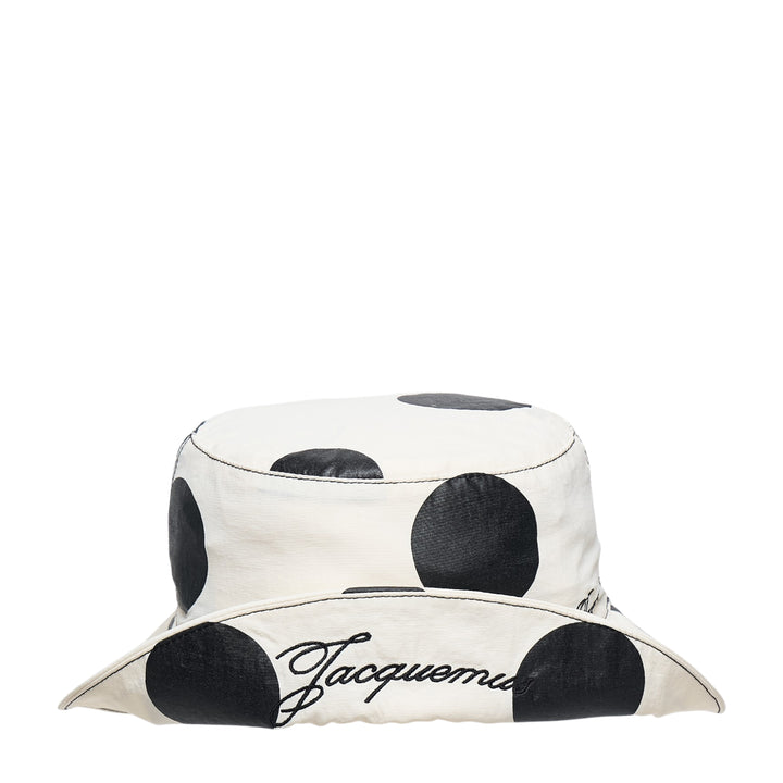 Jacquemus Le Bob Baluchon bucket hat in off-white with large black polka dots, featuring a wide brim with contrast topstitching and script logo detail - view 4