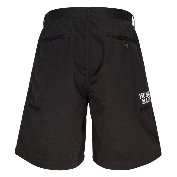 Human Made Skater Shorts in black with embroidered heart-and-arrow logo near the hem and yellow woven brand label at the waistband