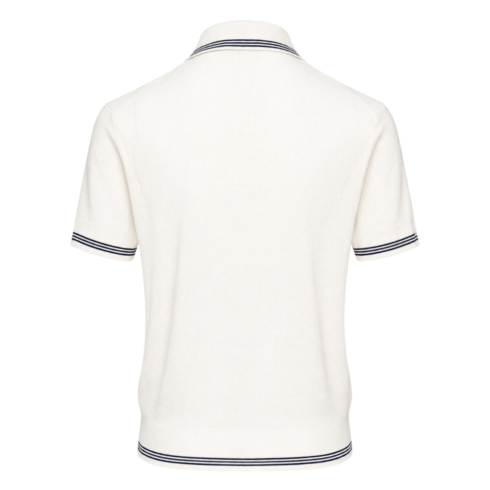 Jacquemus Le Polo Voilier off-white textured knit polo shirt with navy tipped collar, cuffs, and hem, three dark buttons on the placket, and a signature triangular chest pocket with button fastening