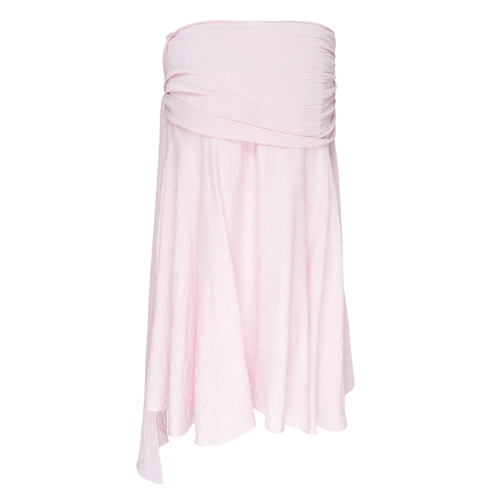 Glowny Sunset Drape Midi Skirt in blush pink with gathered ruched waistband, knotted side tie, and asymmetric handkerchief hem