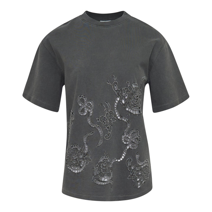 Ganni Heavy Cotton Embroidery Tee in washed charcoal grey, featuring tonal floral cutwork lace embroidery across the front, with a relaxed boxy fit and ribbed crew neckline