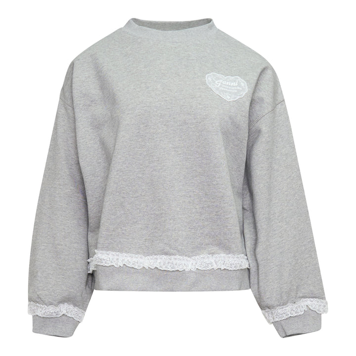 Ganni Isoli Sweater in heather grey marl with white lace frill trim at the hem and cuffs, and an embroidered heart-shaped Ganni logo patch on the chest