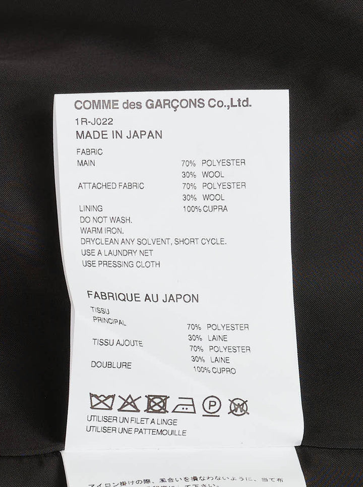 Black single-breasted herringbone tailored jacket with curved patchwork panel inserts, notch lapel and flap pockets by Comme des Garçons Black - view 3