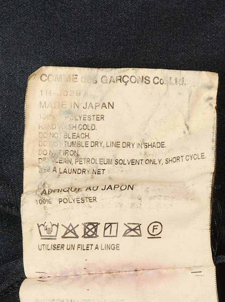 Comme des Garçons BLACK heavy polyester satin jacket in black, featuring a mandarin collar, three frog-button closures, and two patch pockets on a white background - view 3