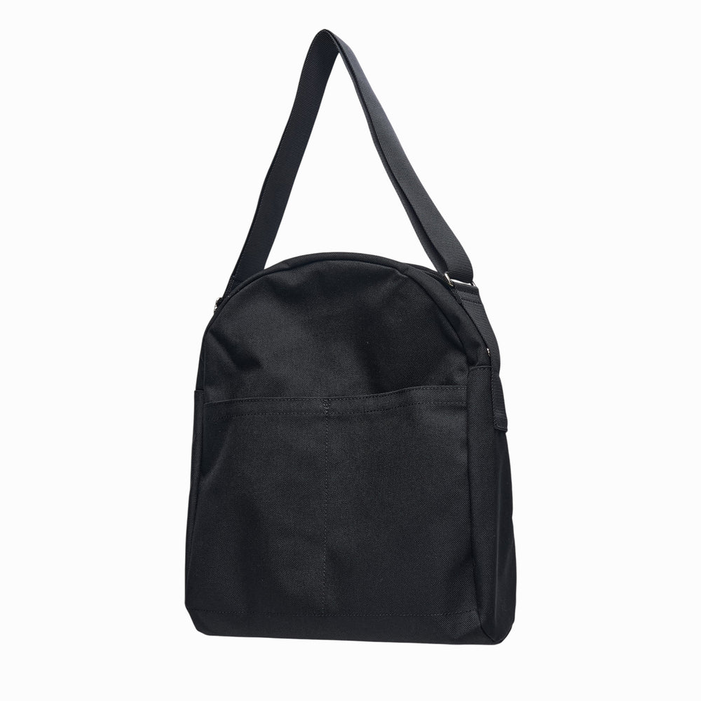 Comme des Garçons BLACK nylon oxford crossbody bag in all-black with adjustable shoulder strap and front zip pocket, shown from the back - view 2