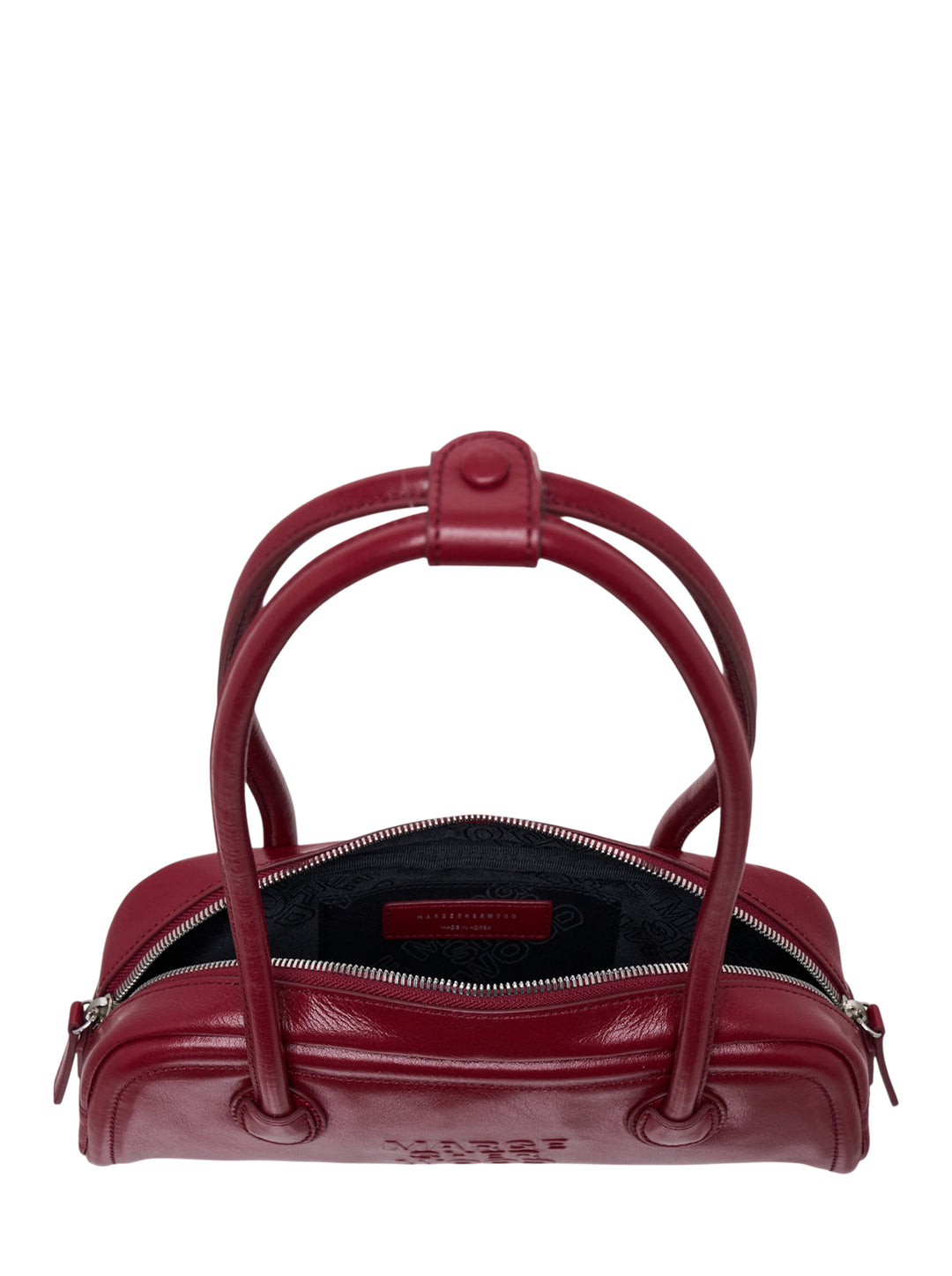 Marge Sherwood Soft Boston EW Mini shoulder bag in deep burgundy crinkle-glazed leather with arched double top handles and embossed logo, front view on white background - view 3