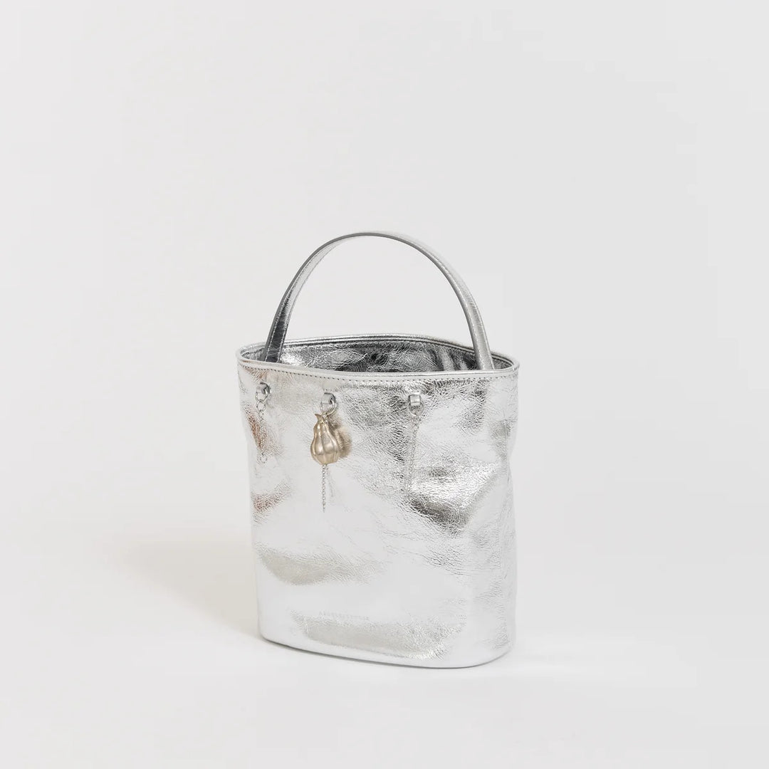 Marge Sherwood Wired Bucket Bag in crinkled metallic silver leather with a slim top handle and gold-tone charm on chain - view 2