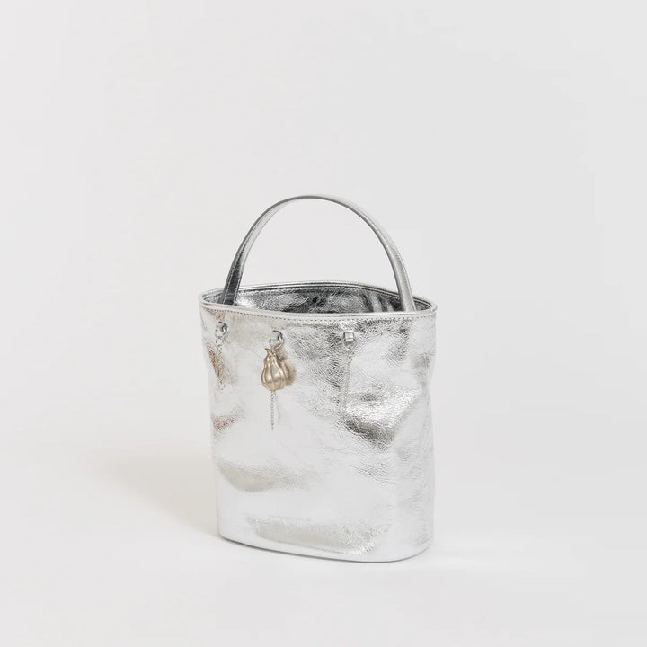 Marge Sherwood Wired Bucket Bag in crinkled metallic silver leather with a slim top handle and gold-tone charm on chain - view 2