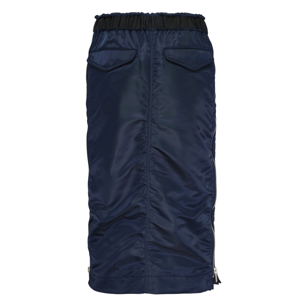 sacai navy nylon twill midi skirt with black elasticated drawstring waistband, angled hip pockets, and ruched side seam detailing