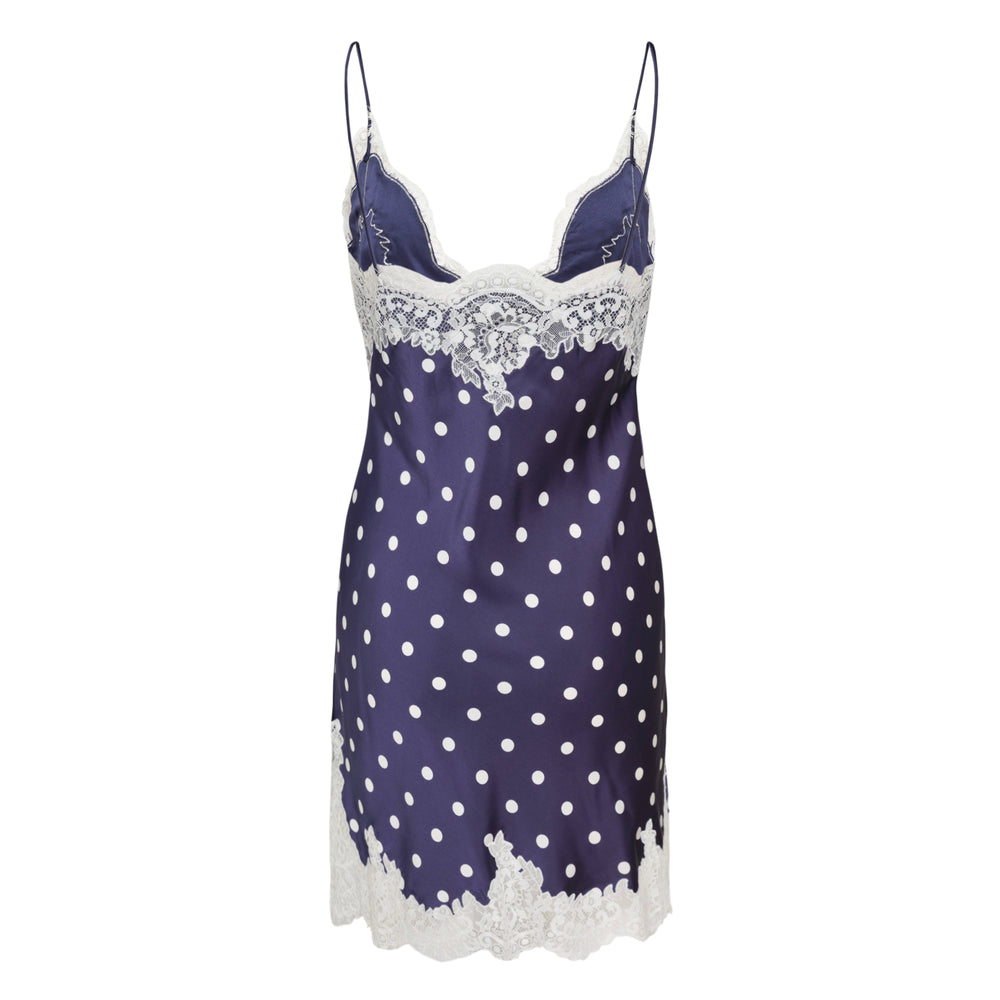 Self-Portrait navy satin mini slip dress with white polka dot print, deep V-neckline with white floral lace trim, matching lace hem, and thin spaghetti straps