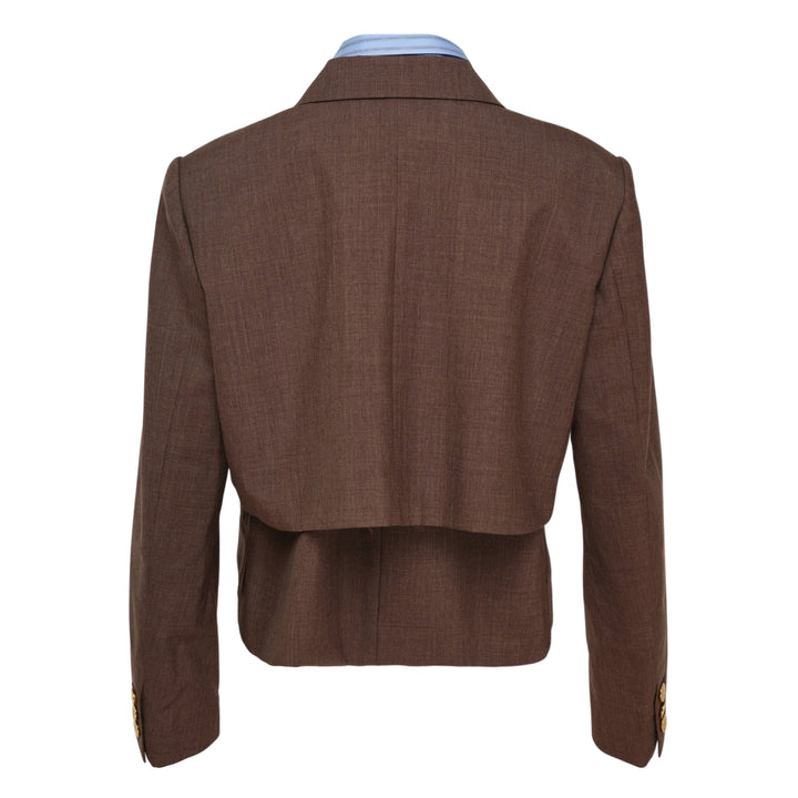 sacai Suiting x Poplin Jacket in brown — a cropped double-breasted blazer with ornate gold buttons layered over a blue striped poplin shirt, shown on a display form against a white background