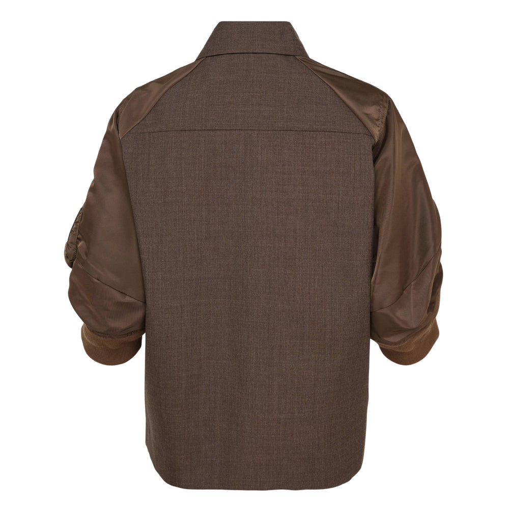 sacai Suiting x Nylon Twill Shirt Jacket in brown, featuring a wool-blend suiting body, nylon bomber-style sleeves with a zip utility pocket, ribbed cuffs, dual flap chest pockets, and a button-front closure