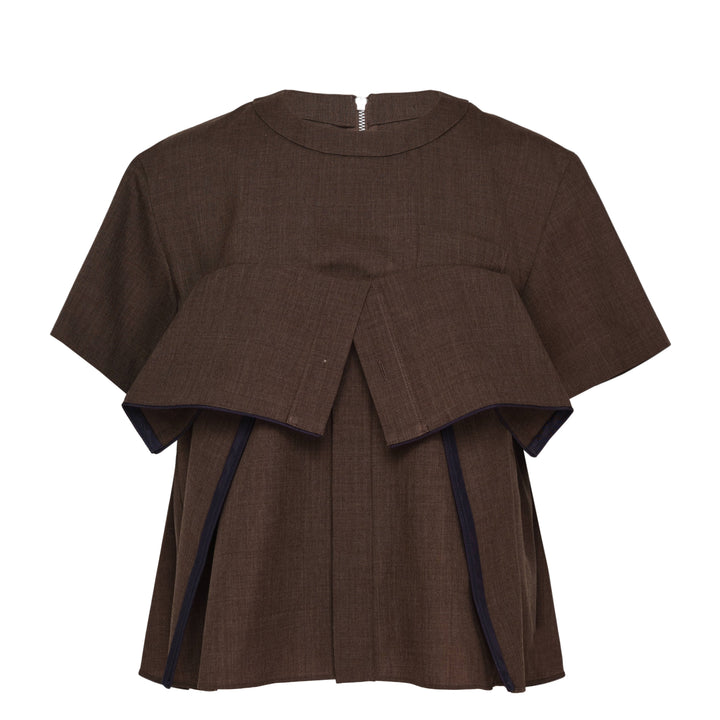 sacai Suiting Short Sleeve Pullover in brown with structured peplum overlay, knife pleats, and contrast navy trim, shown from the back