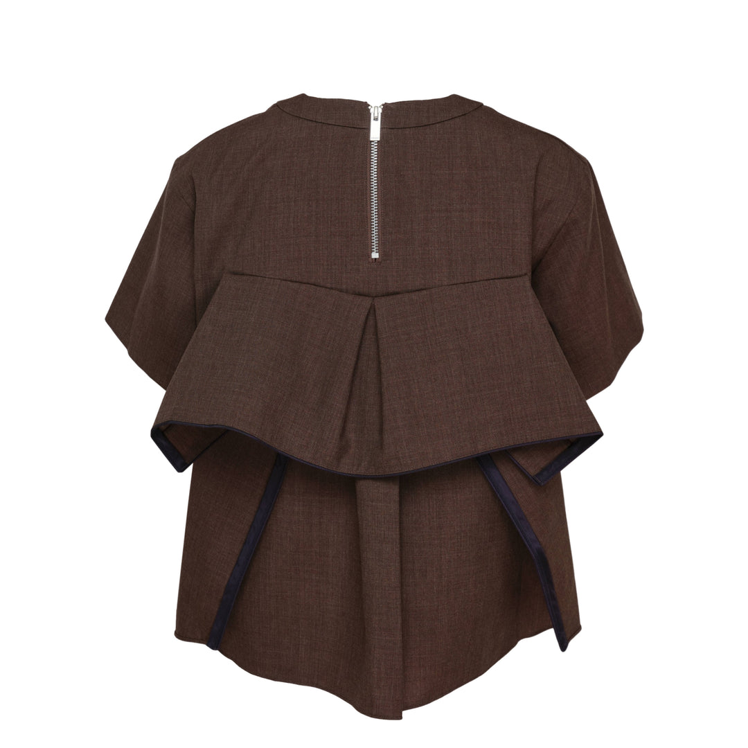 sacai Suiting Short Sleeve Pullover in brown with structured peplum overlay, knife pleats, and contrast navy trim, shown from the back