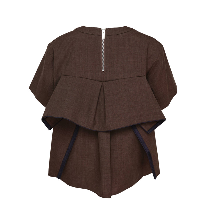 sacai Suiting Short Sleeve Pullover in brown with structured peplum overlay, knife pleats, and contrast navy trim, shown from the back