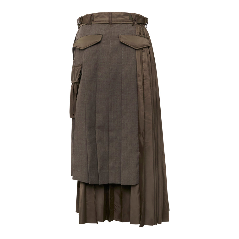sacai Suiting x Nylon Twill Skirt in taupe — midi length with mixed fabric panels, deep knife pleats, layered nylon hem, and a patch cargo pocket