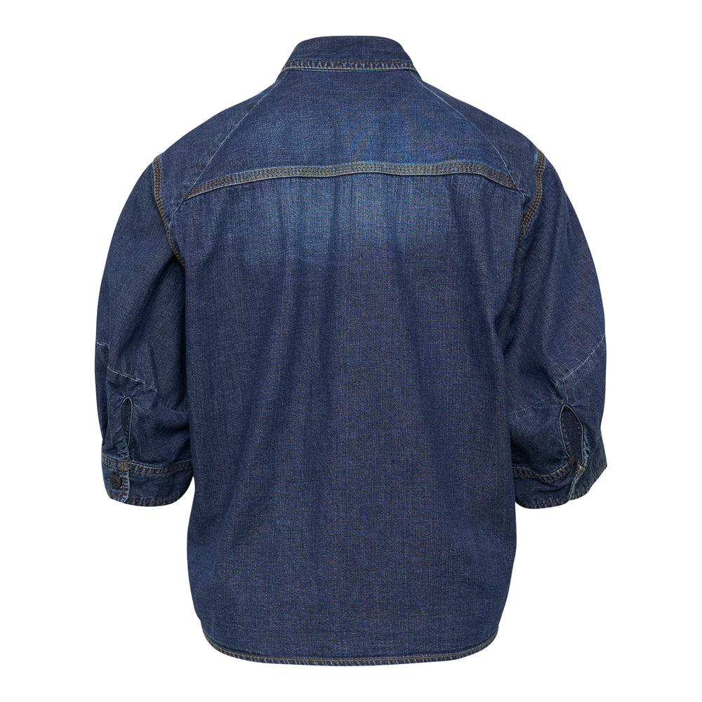 sacai cropped washed indigo denim shirt with contrast yellow topstitching, dual buttoned chest pockets, and three-quarter sleeves, front view on white background
