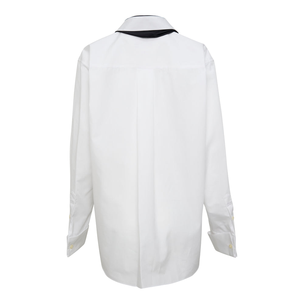 sacai white poplin long-sleeve shirt with an attached draped black chiffon scarf looped through the collar, shown on a white background