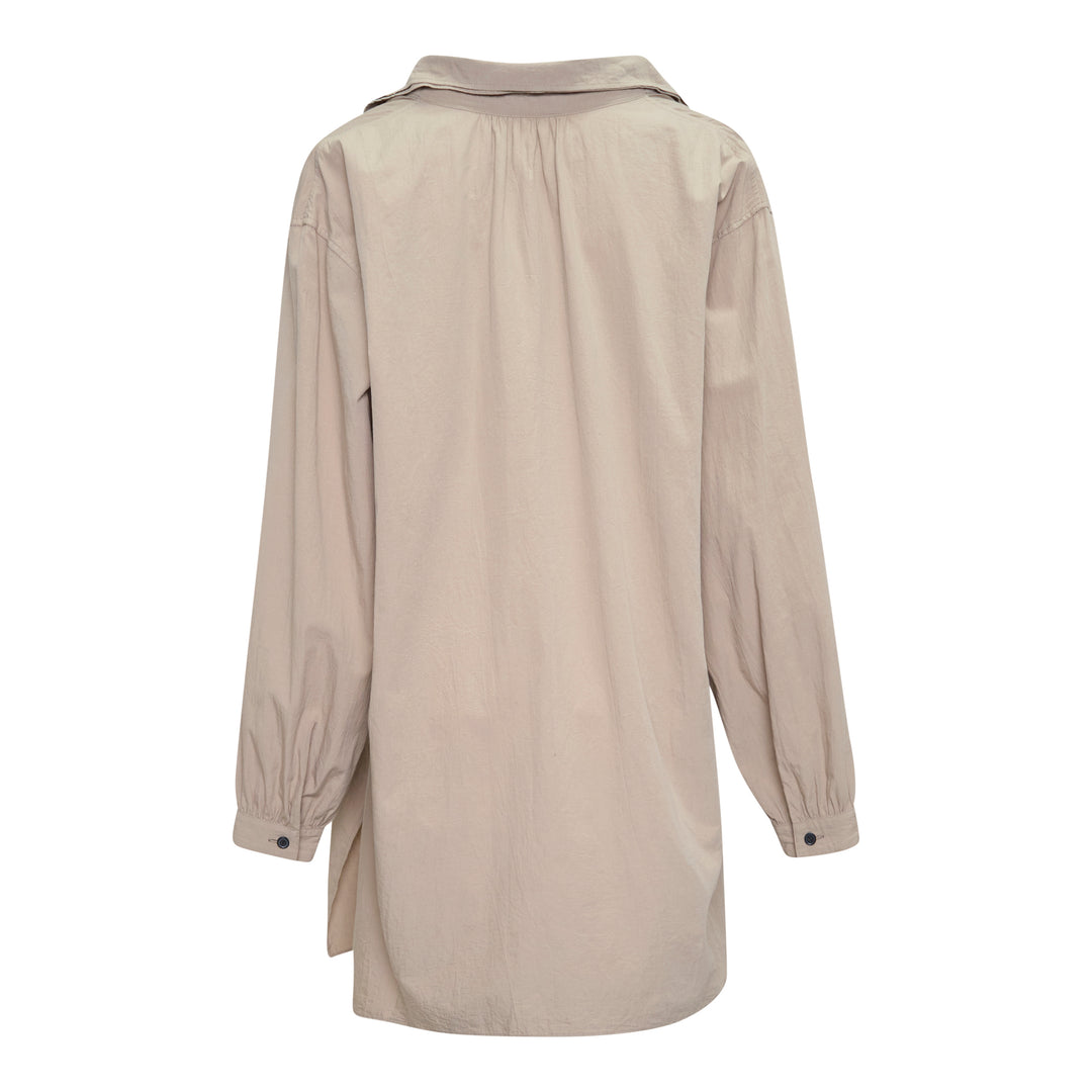 Y's Gather Collar Hooded Coat in sand beige, featuring a drawstring gathered hood with bow-tie fastenings, button-front closure, large hip patch pockets, and elasticated cuffs, displayed flat on a white background