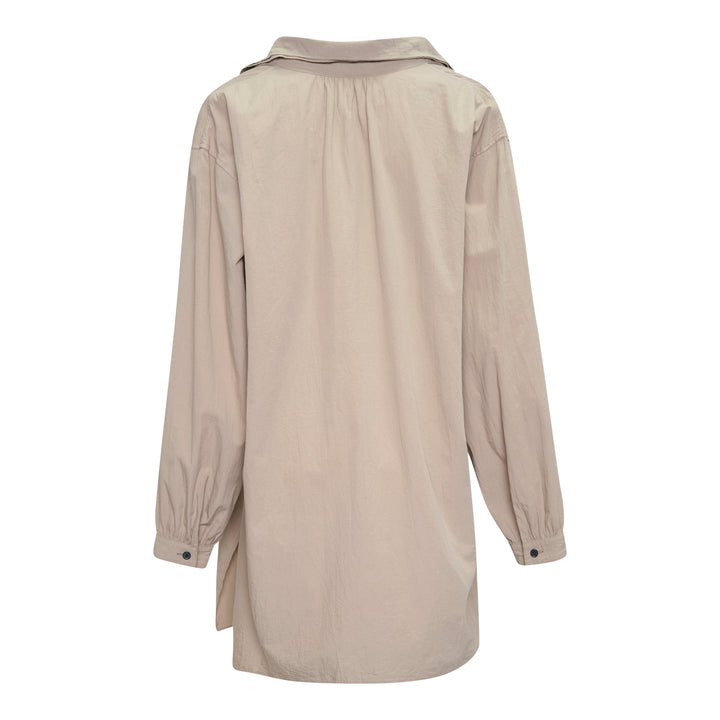 Y's Gather Collar Hooded Coat in sand beige, featuring a drawstring gathered hood with bow-tie fastenings, button-front closure, large hip patch pockets, and elasticated cuffs, displayed flat on a white background