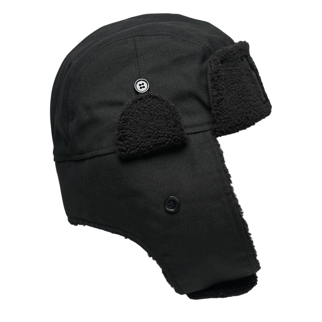 Y's all-black wool trapper hat with sherpa fleece lining, fold-down ear flaps with chin strap, and tonal embroidered Y's logo on the front panel, photographed from the front on a white background. - view 2
