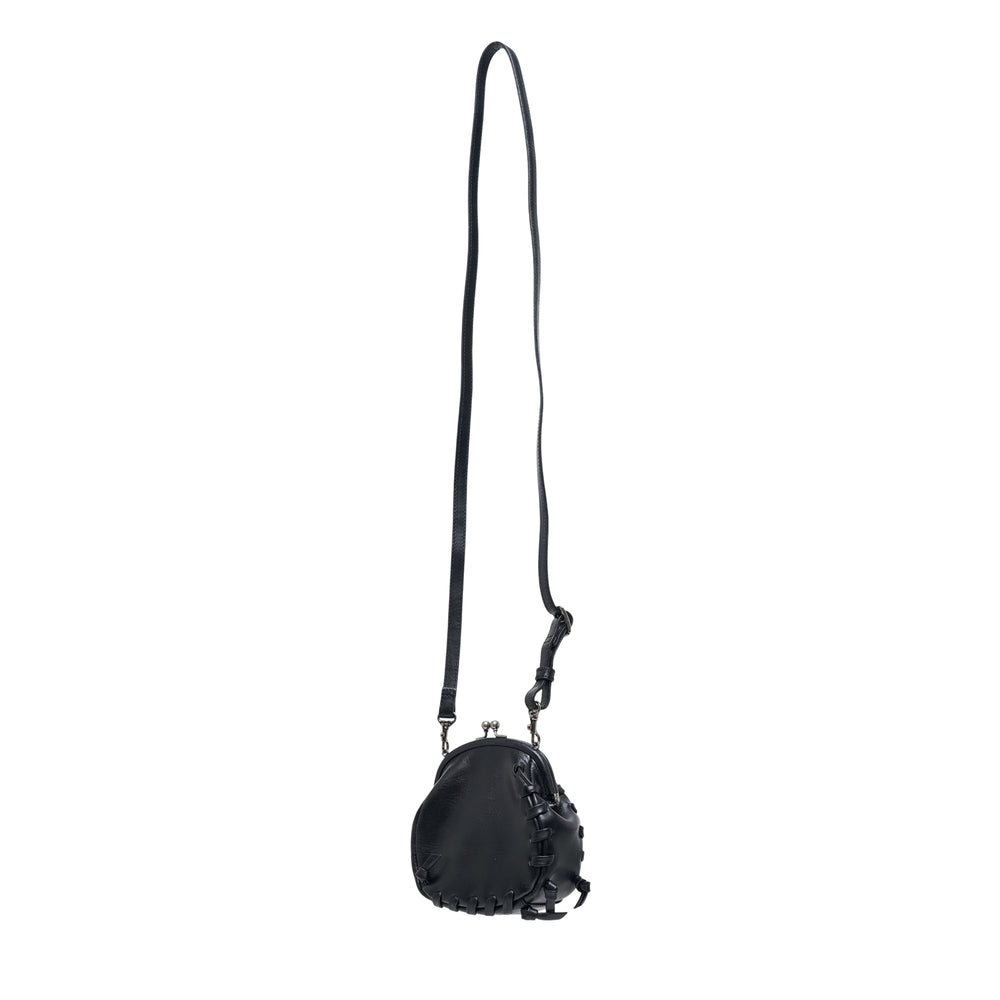 Y's mini black leather shoulder bag with whipstitch detailing, kiss-lock metal clasp frame, and long gunmetal chain strap, shown against a white background