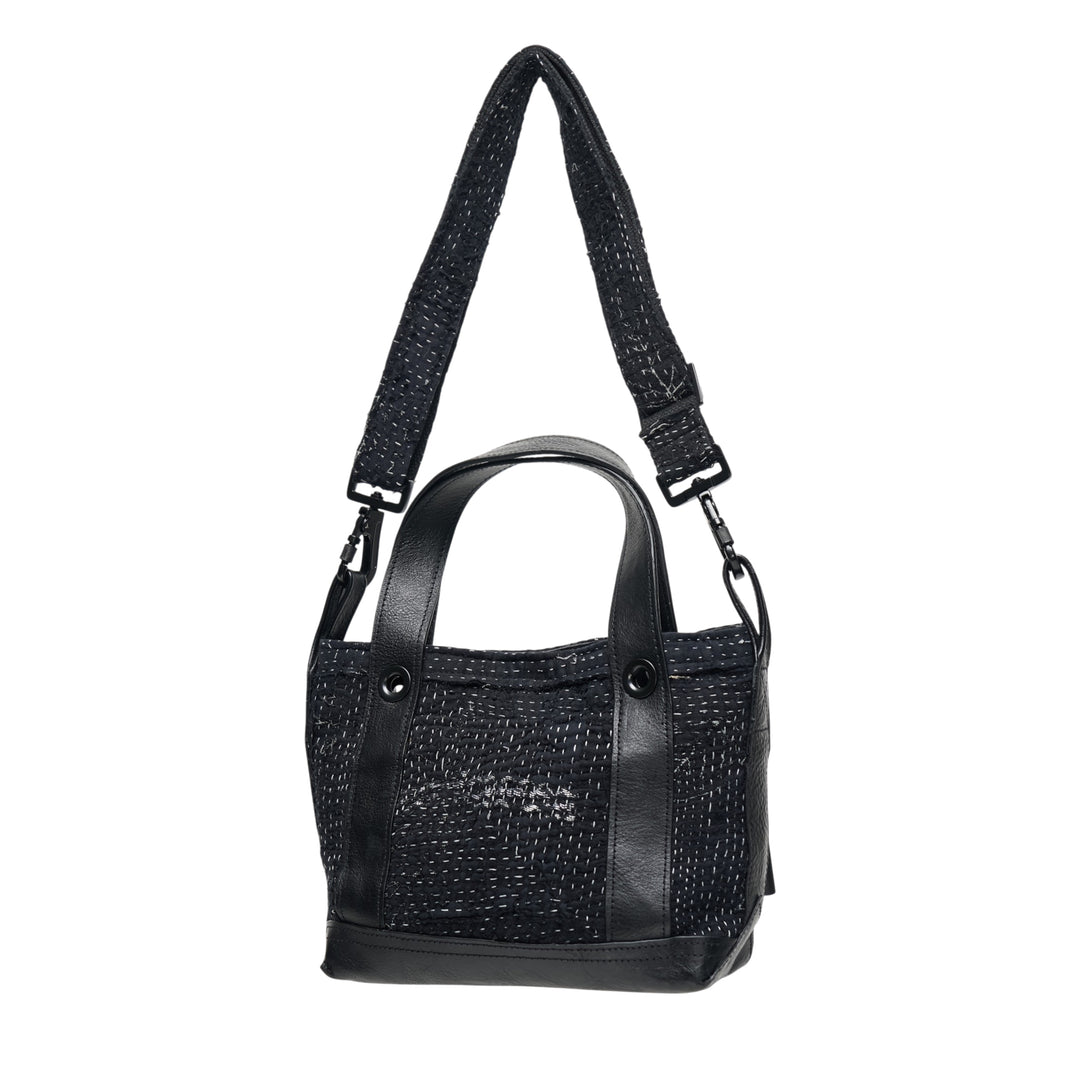 Y's x FAF 008 black kantha-stitched tote bag with pebbled leather trim, dual short handles, and a wide adjustable crossbody strap with gunmetal hardware - view 2