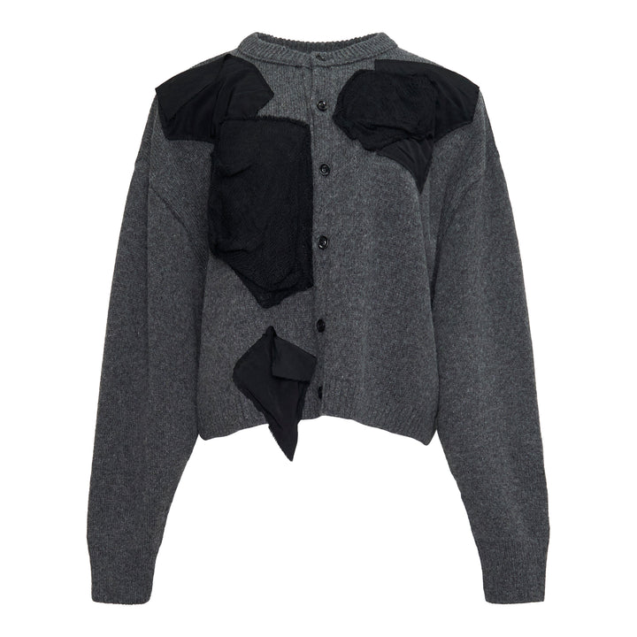 Y's Appliqué Short Cardigan in grey marl wool-blend, featuring cascading black mixed-fabric appliqué panels in organza and boucle across the front, with button fastening and ribbed cuffs, back view on white background