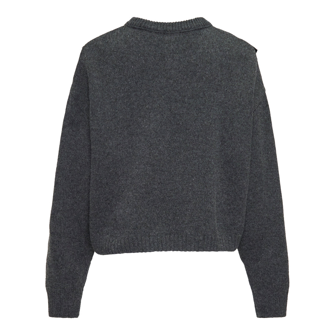 Y's Appliqué Short Cardigan in grey marl wool-blend, featuring cascading black mixed-fabric appliqué panels in organza and boucle across the front, with button fastening and ribbed cuffs, back view on white background